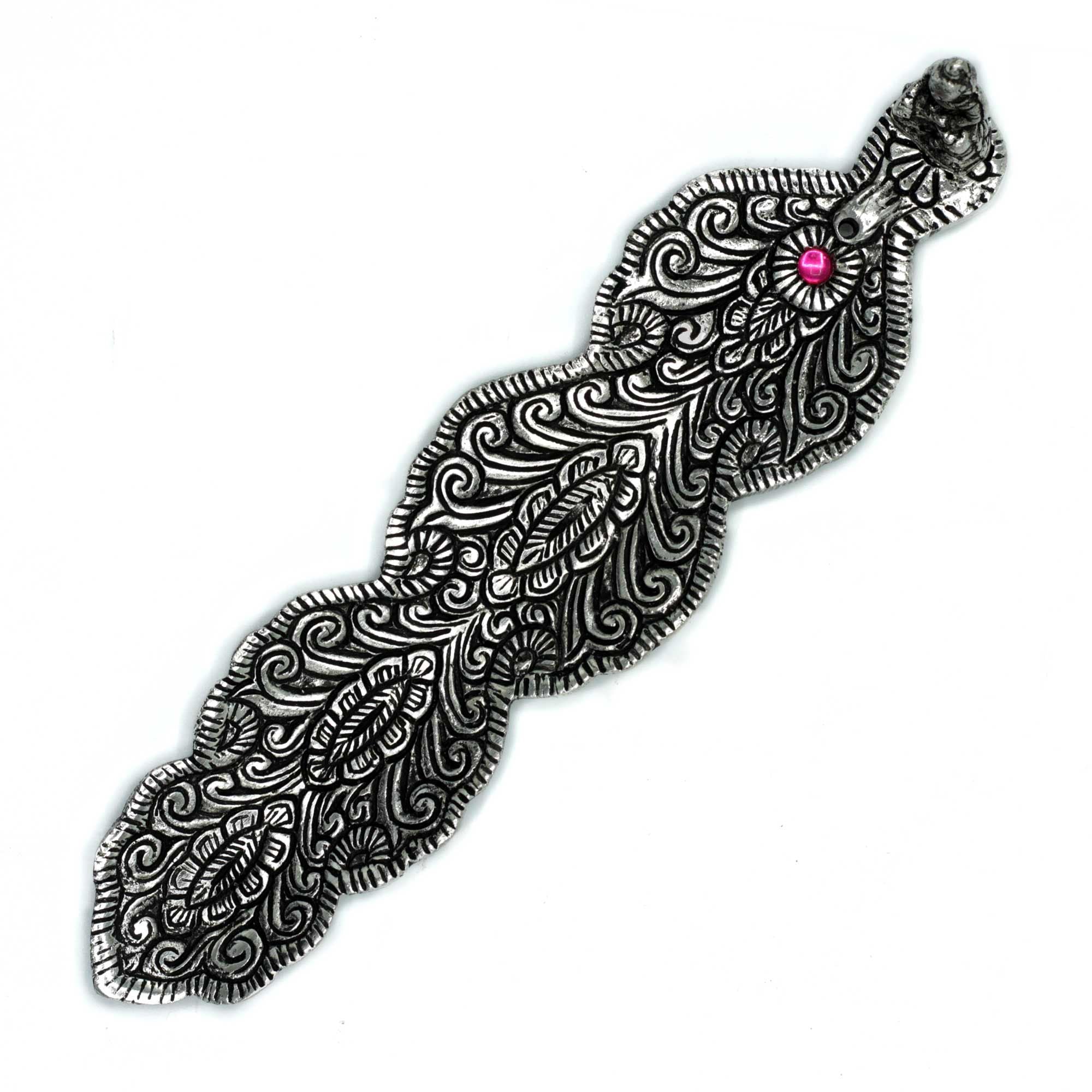 Decorative silver snake-shaped object with a pink gem on a white background