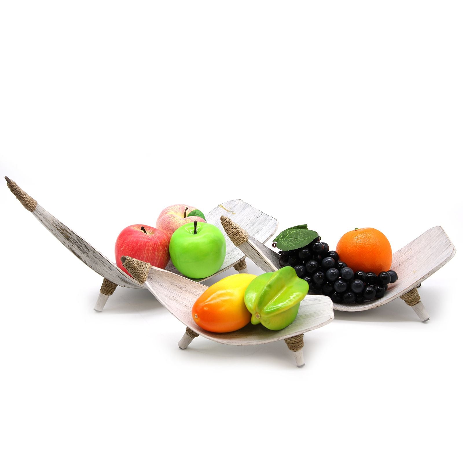 Fruit set on a decorative wooden stand with a white background