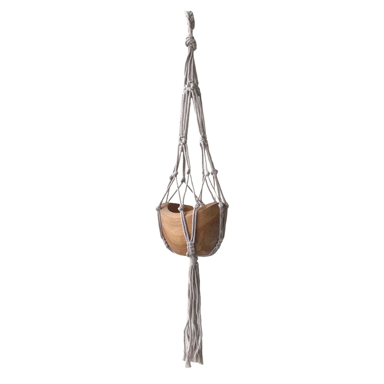 Macrame plant hanger with a wooden planter on a white background