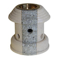 Decorative stone candle holder with brass interior on a white background