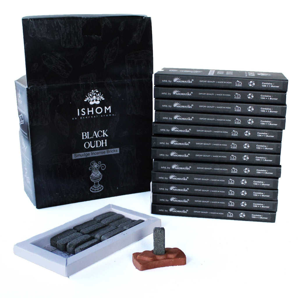 Ishom Black Oudh incense packaging with incense sticks and holder on a white background