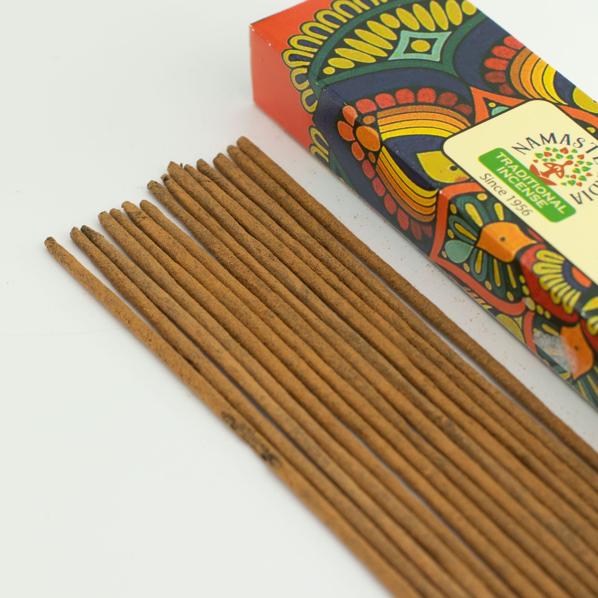 Incense sticks with a colorful box labeled 'Namasté' on a white background