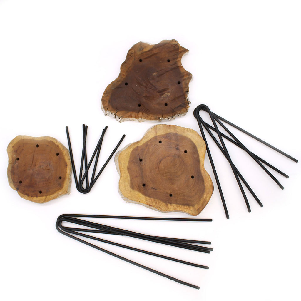 Wooden coasters with black straws on a white background