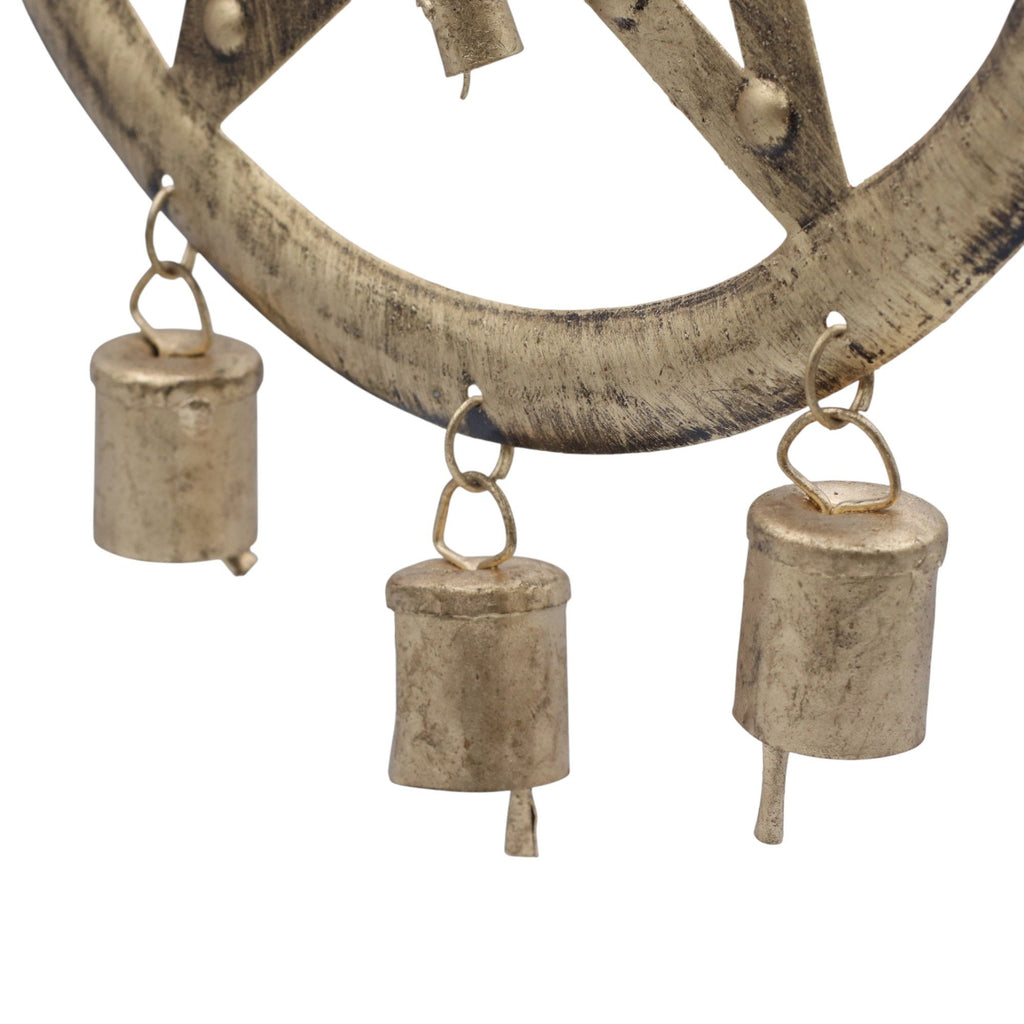 Decorative metal wall hanging with circular design and hanging cylindrical elements on a white background