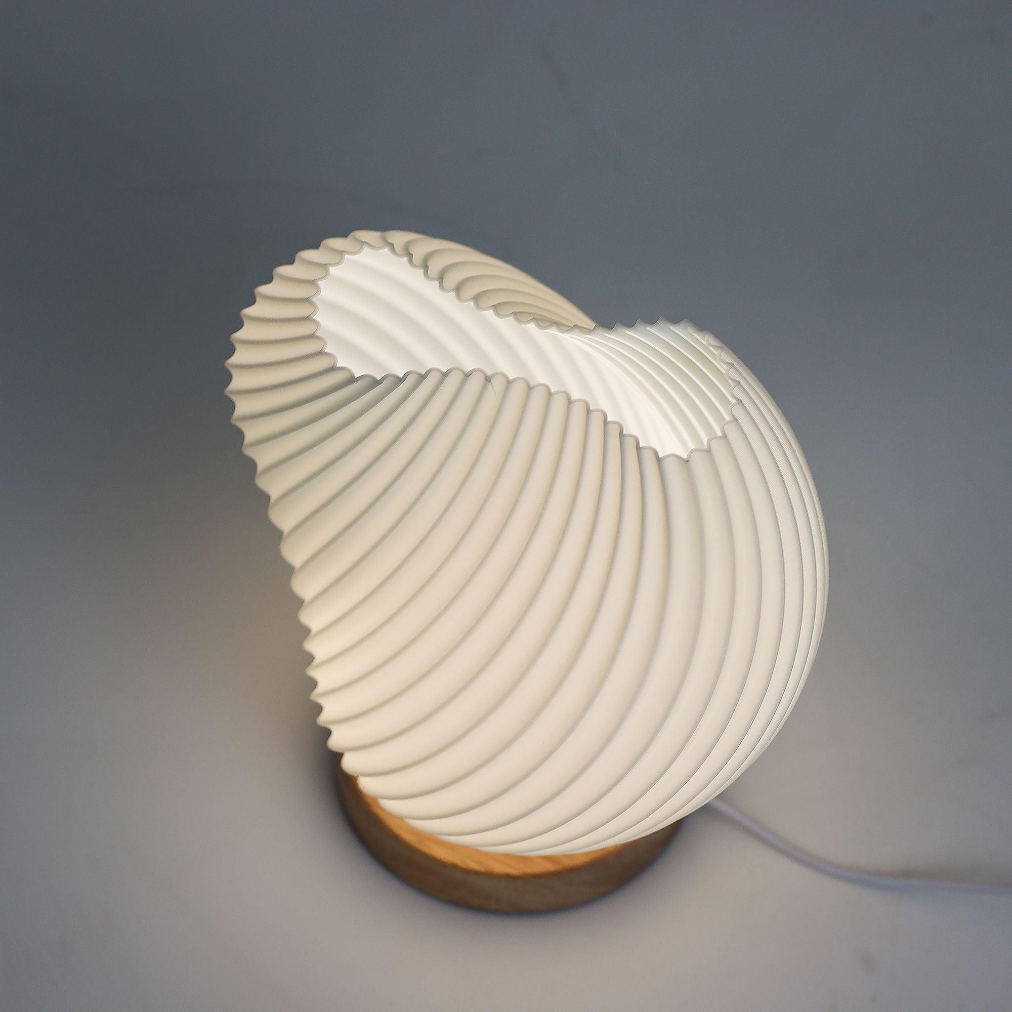 Modern wall lamp with a unique design on a gray background