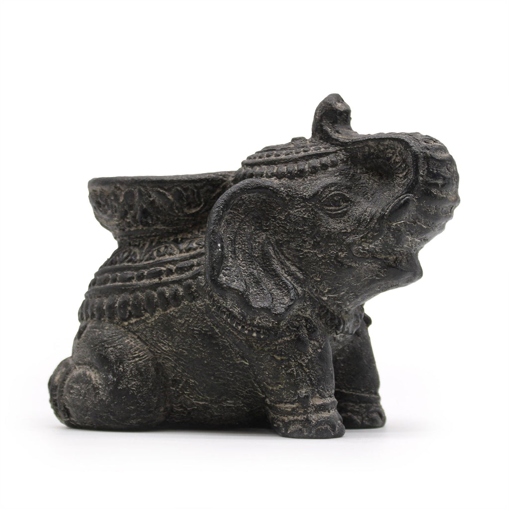 Decorative elephant figurine with intricate designs on a white background