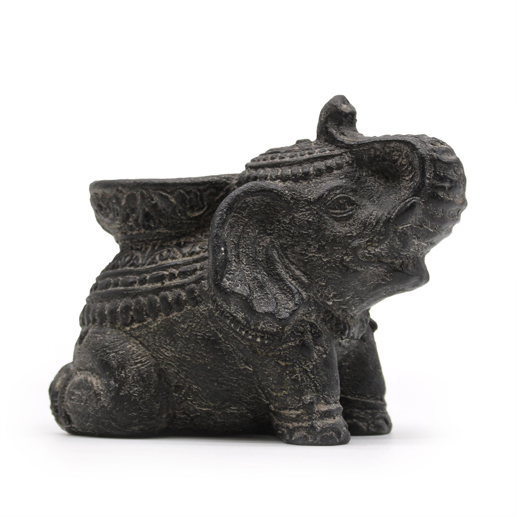 Decorative elephant figurine with intricate designs on a white background