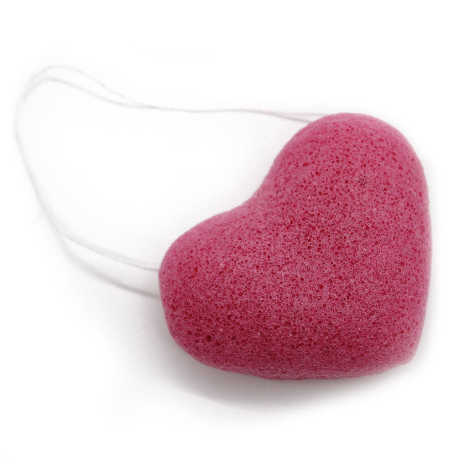 Heart-shaped pink sponge on a white background