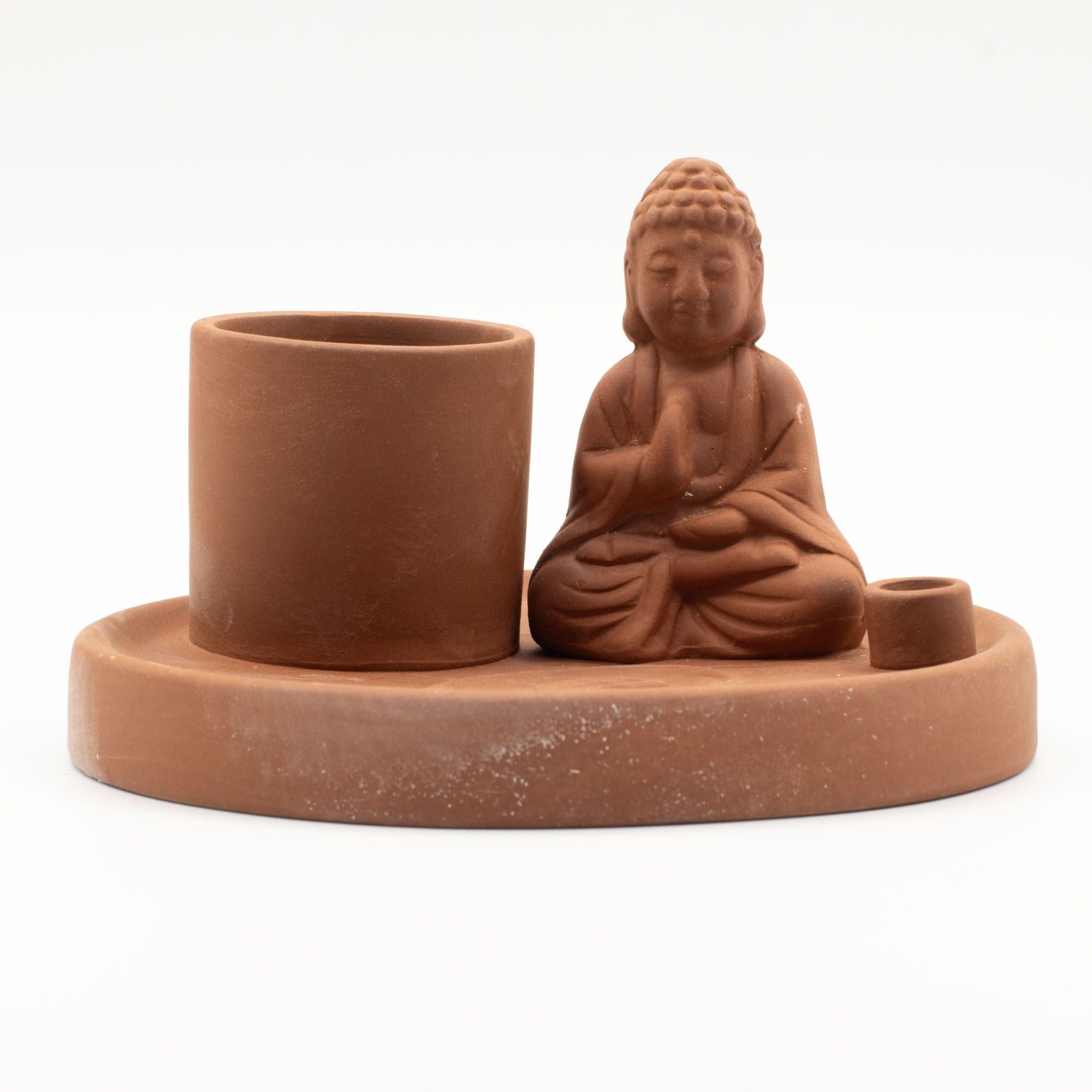 Terracotta Buddha figurine with a cylindrical container on a white background
