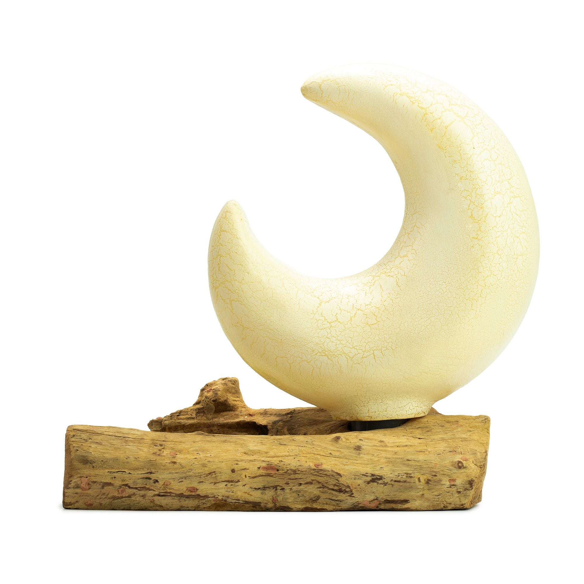 Decorative moon sculpture on a wooden base with a white background