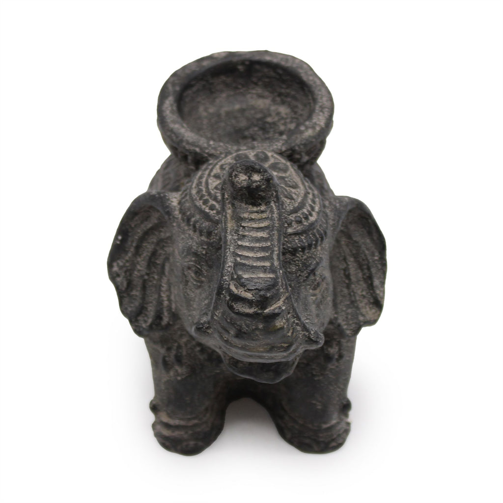 Black elephant-shaped oil lamp on a white background