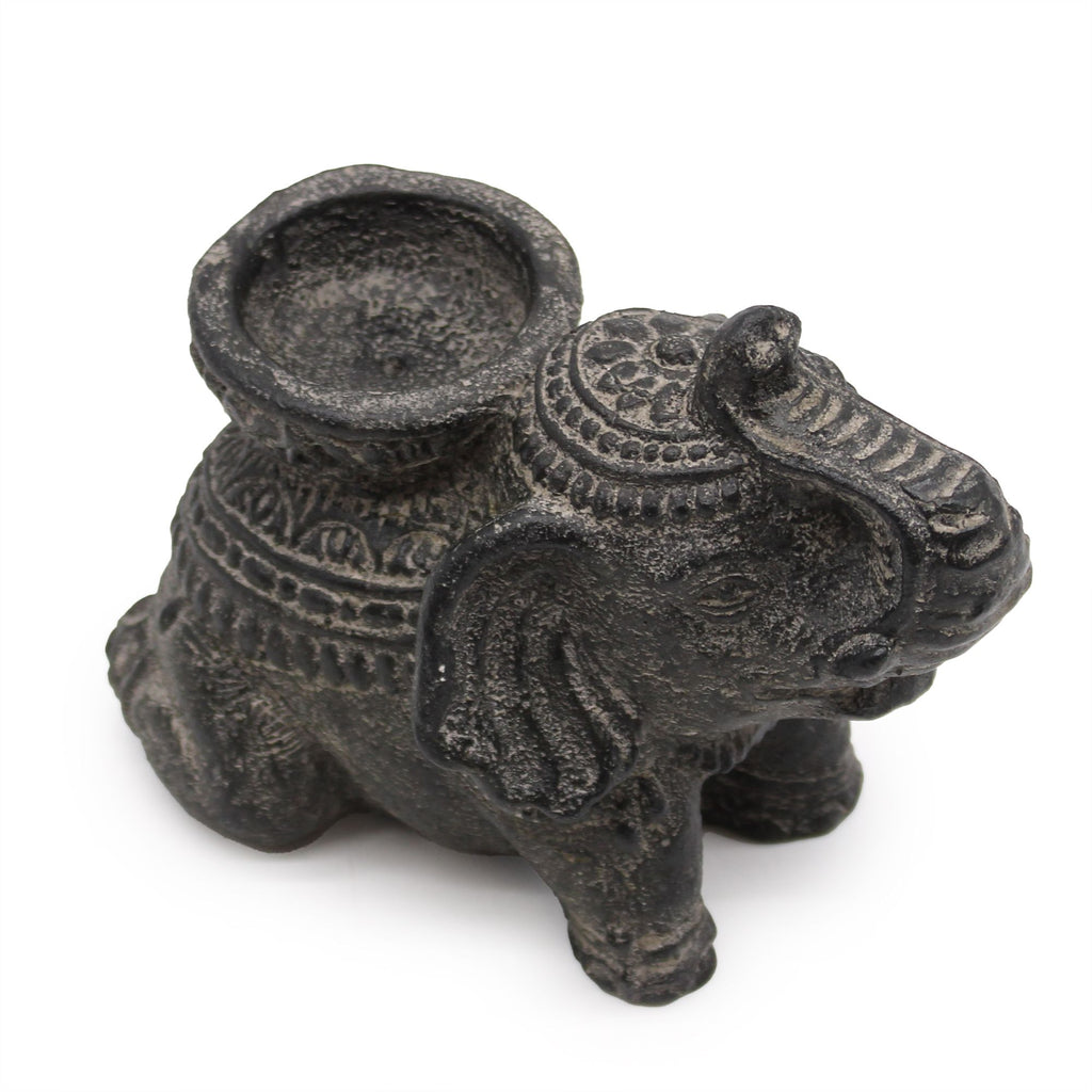 Decorative elephant-shaped candle holder on a white background