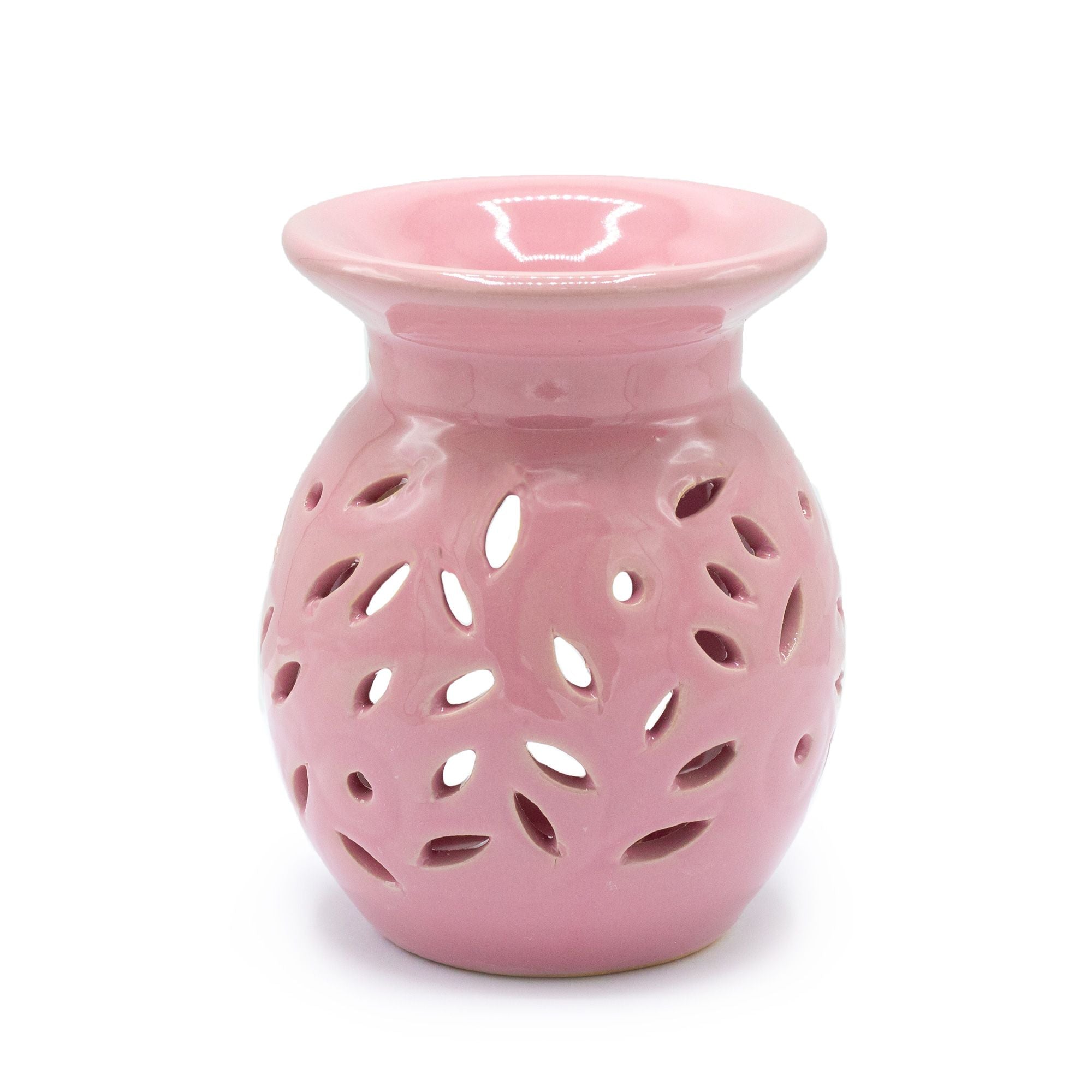 Pink ceramic oil burner with a white background