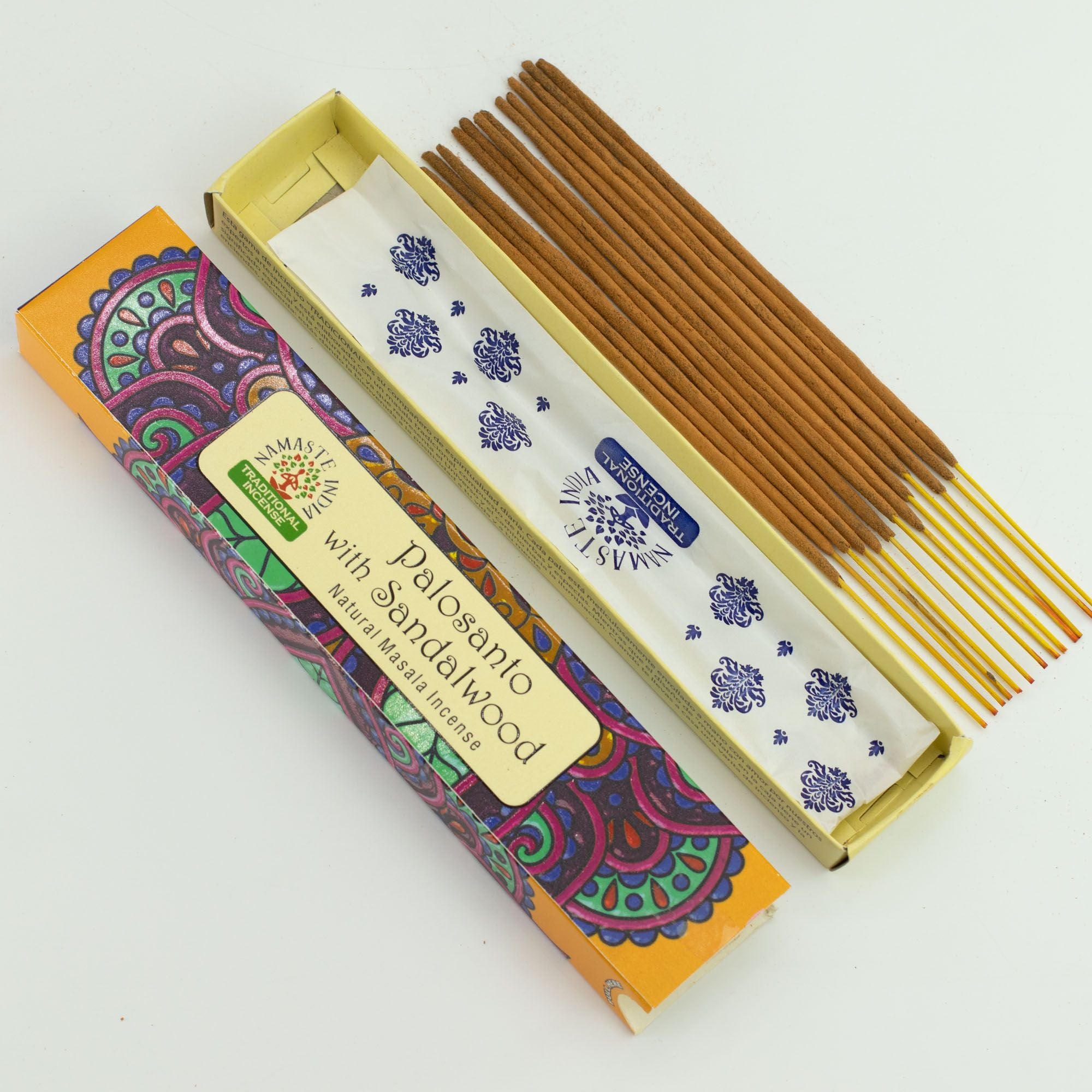Incense sticks with a colorful box on a white background