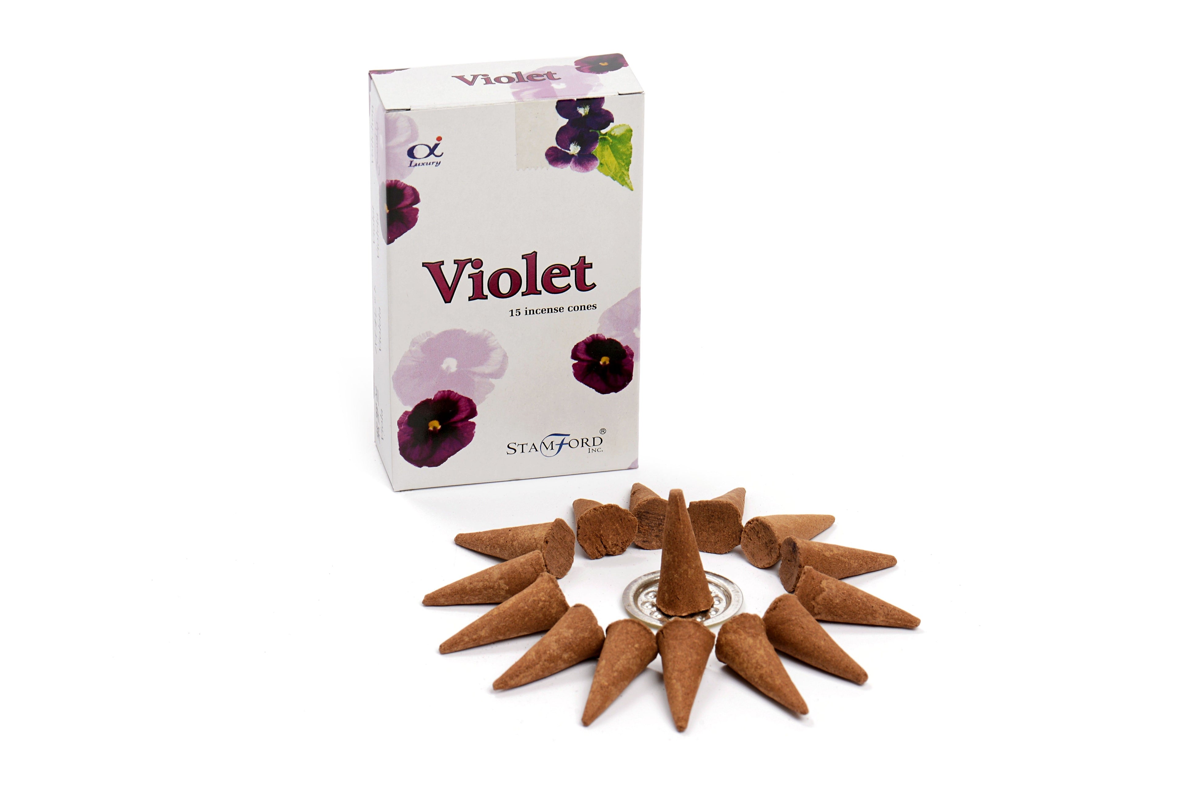 Violet incense cones with packaging on a white background