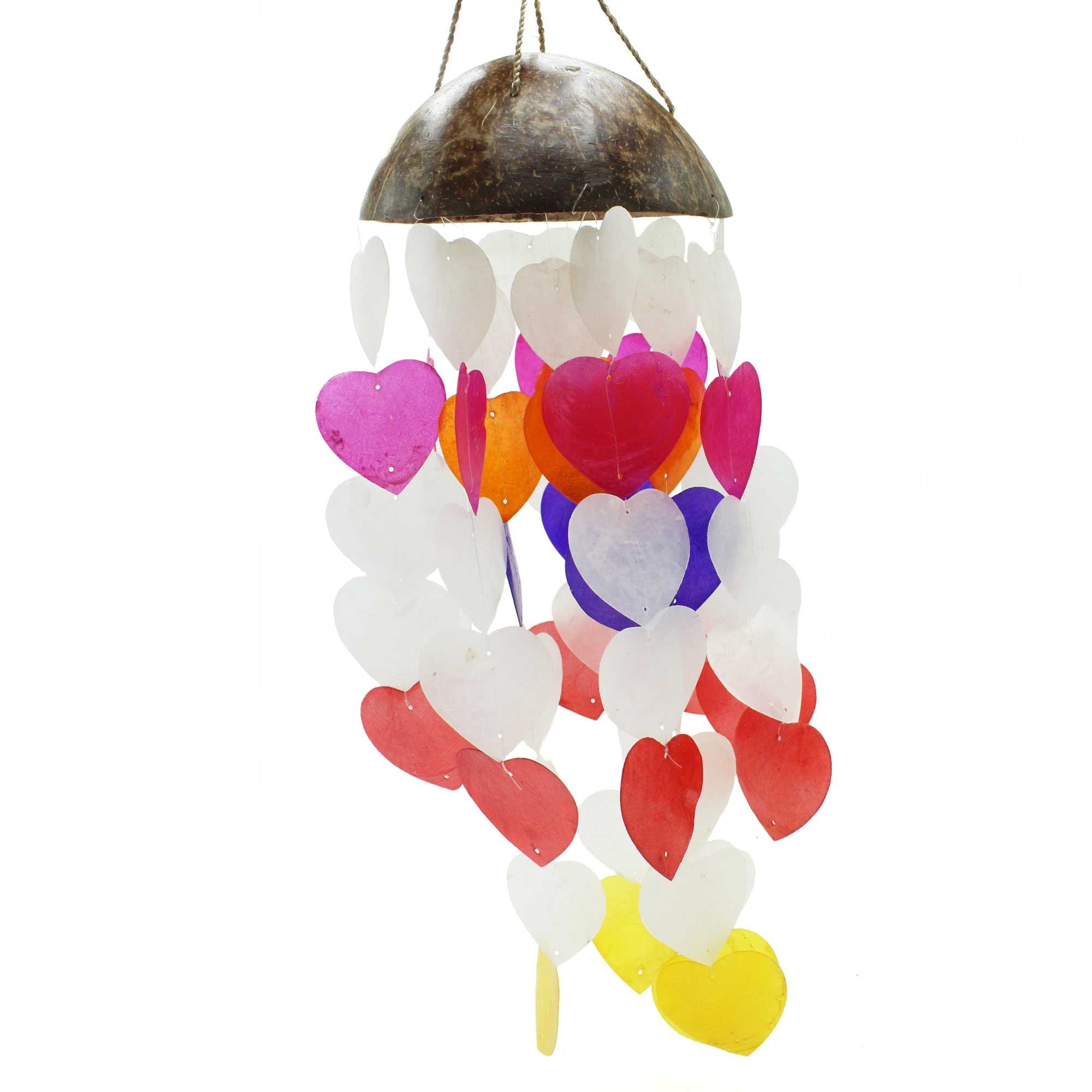 Colorful heart-shaped wind chime hanging from a coconut shell on a white background