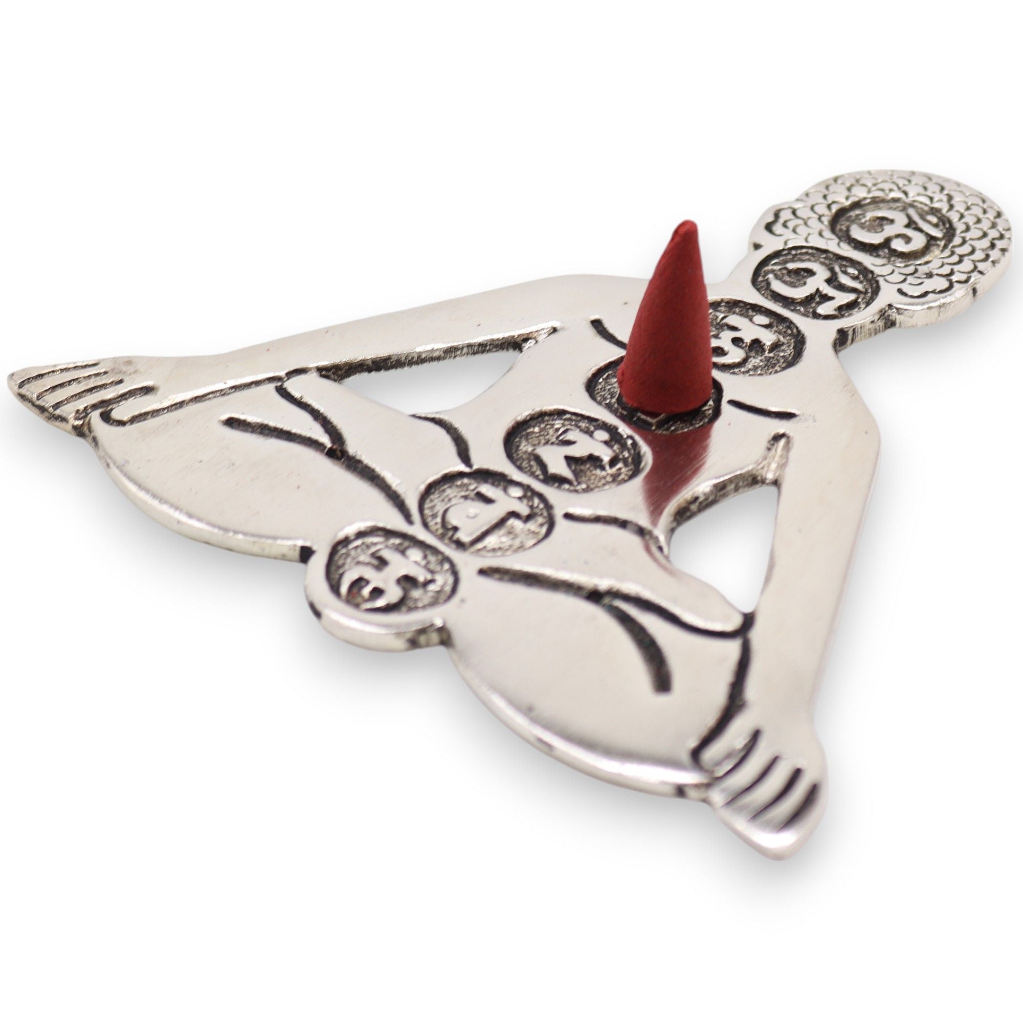 Decorative metal incense holder with a red cone on a white background