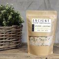 Kraft paper packaging of Himalayan salt with a plant in the background