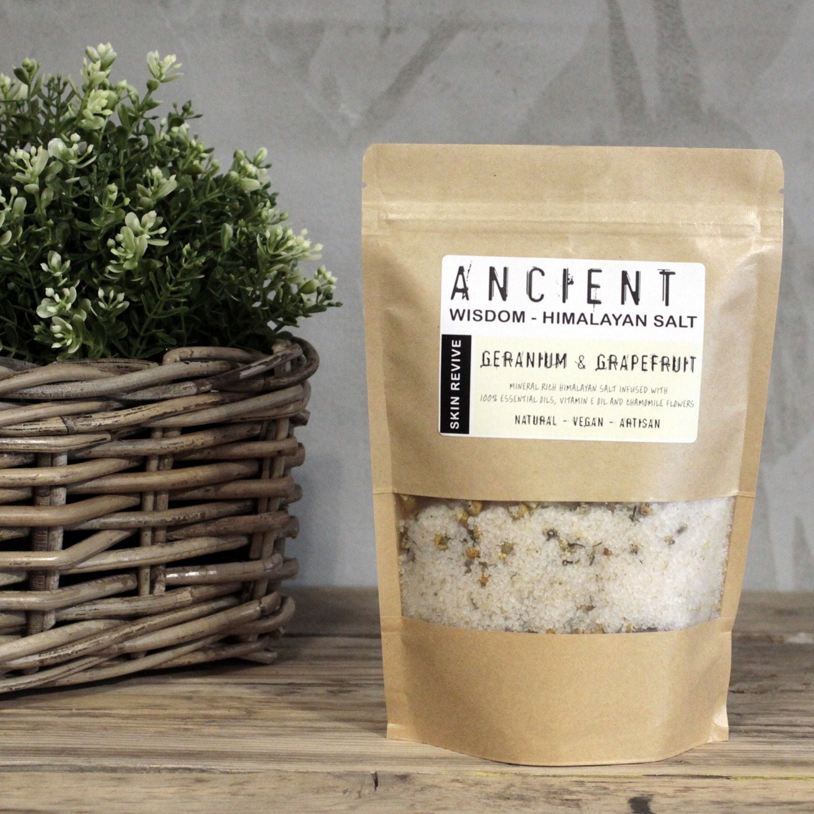 Kraft paper packaging of Himalayan salt with a plant in the background