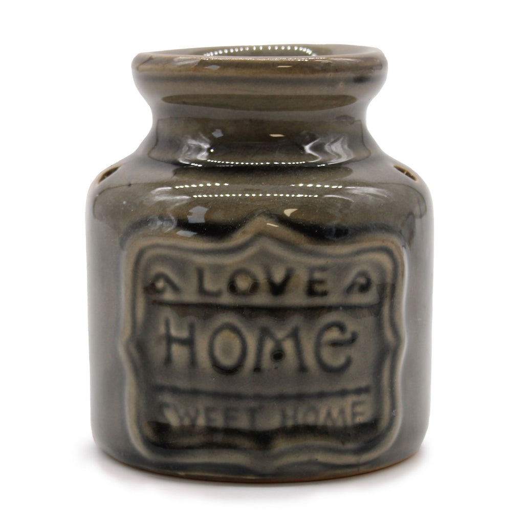 Ceramic jar with 'Love Home Sweet Home' text on a white background