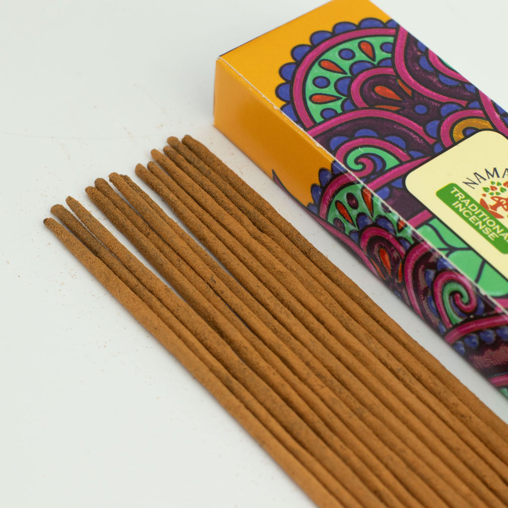 Incense sticks with a colorful box on a white background