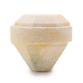 Hexagonal stone container with a textured surface on a white background