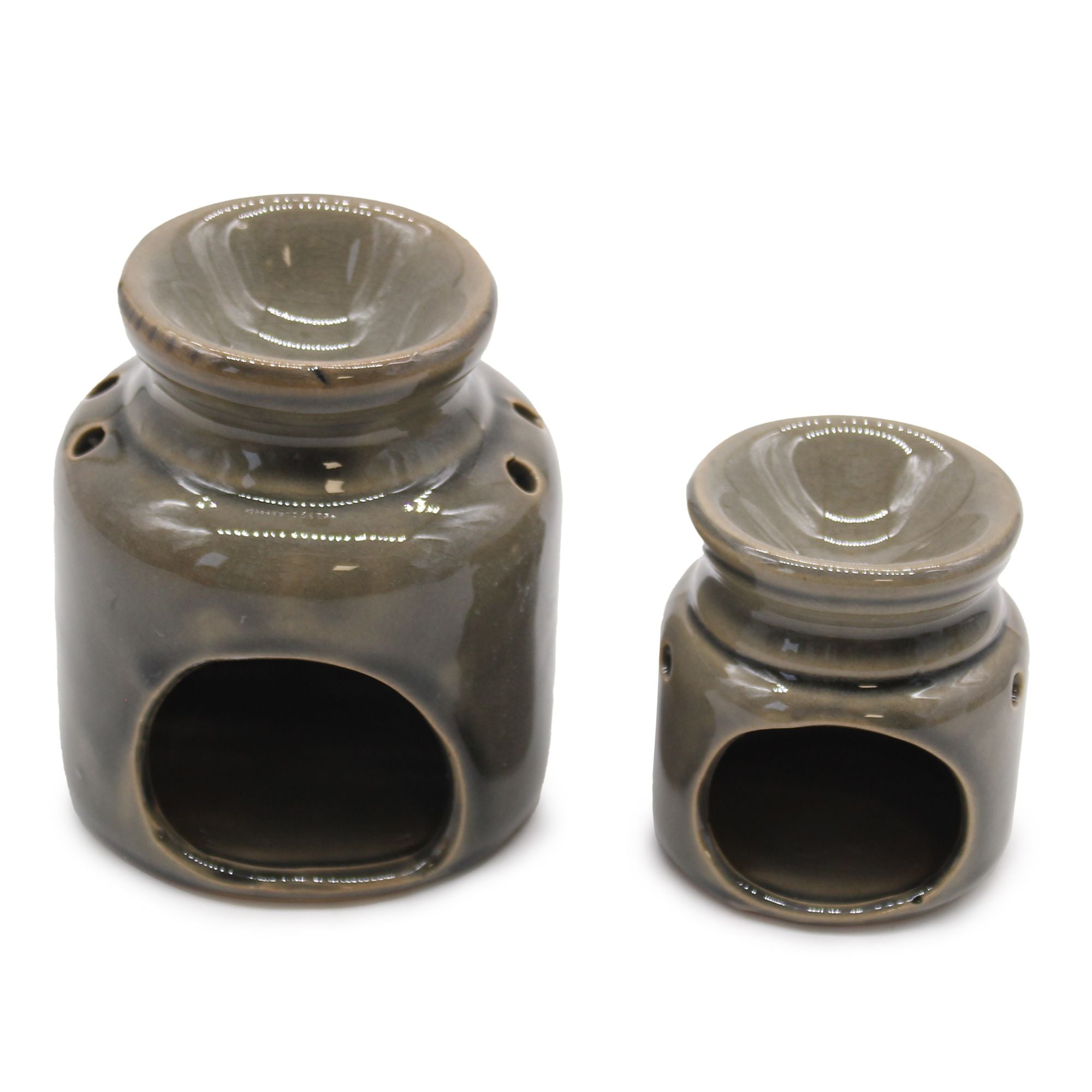Two ceramic oil burners with a brown glaze on a white background
