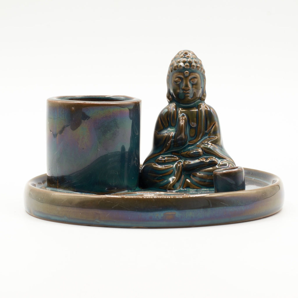 Ceramic incense burner with Buddha figure on a white background
