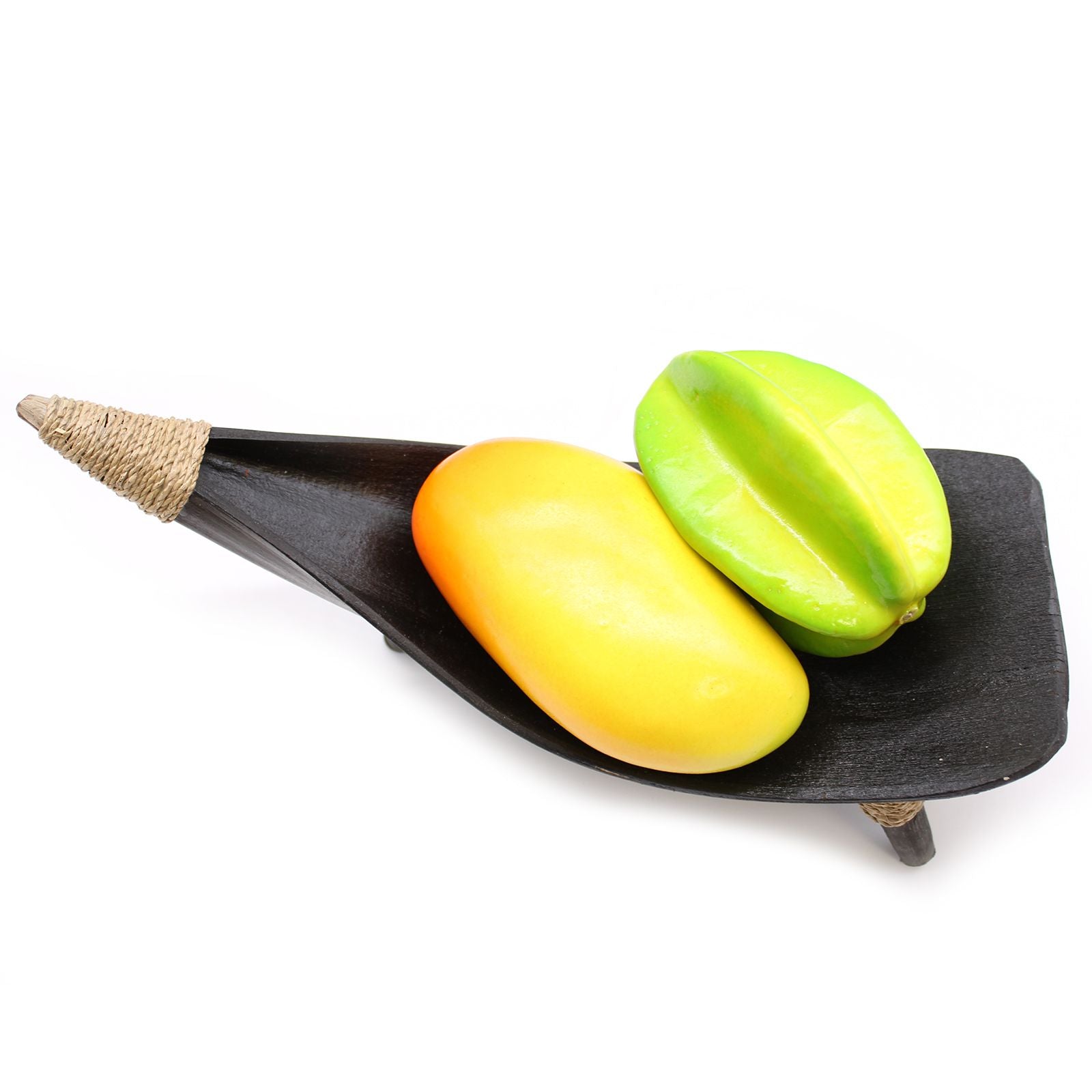 Two star fruits on a black leaf-shaped plate with a white background