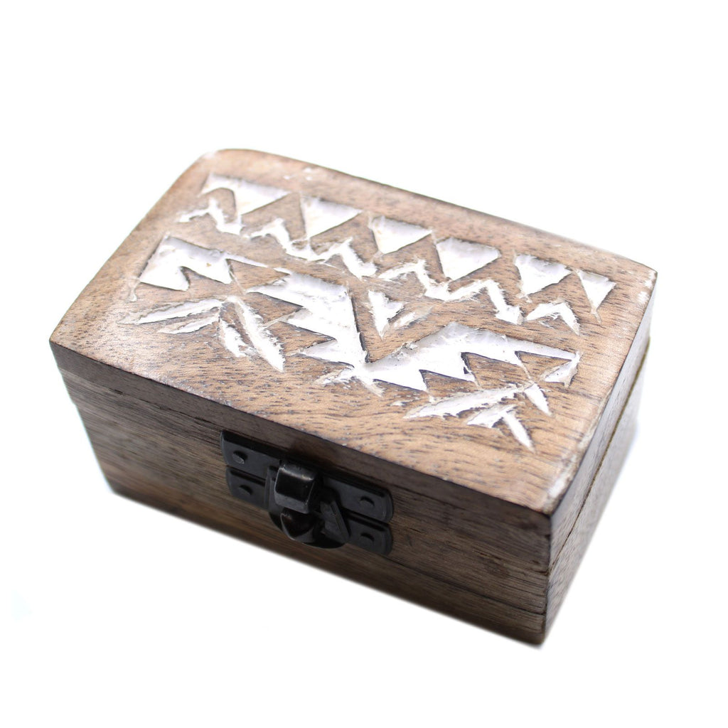 Wooden box with geometric cutout design on a white background