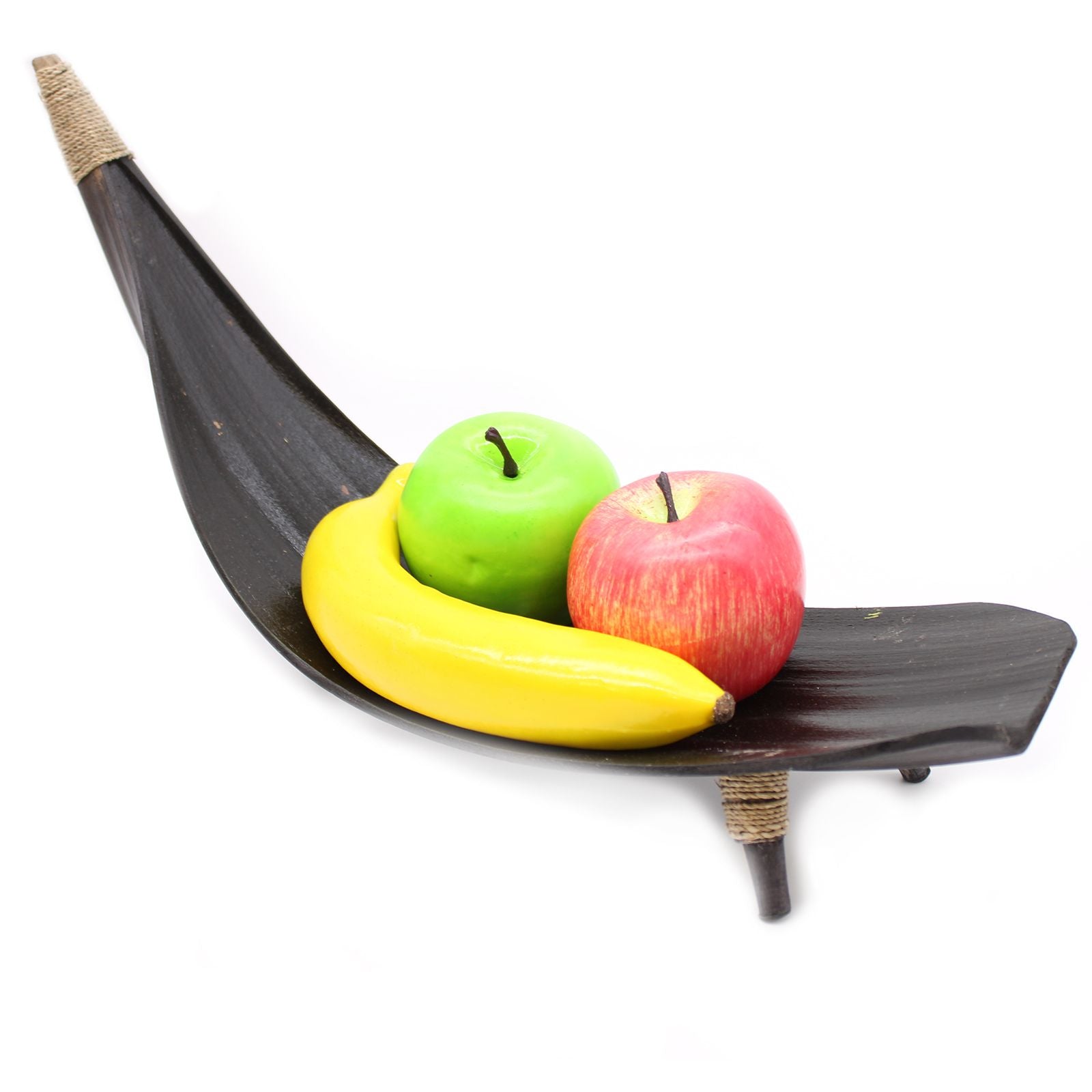 Fruit in a wooden hammock on a white background
