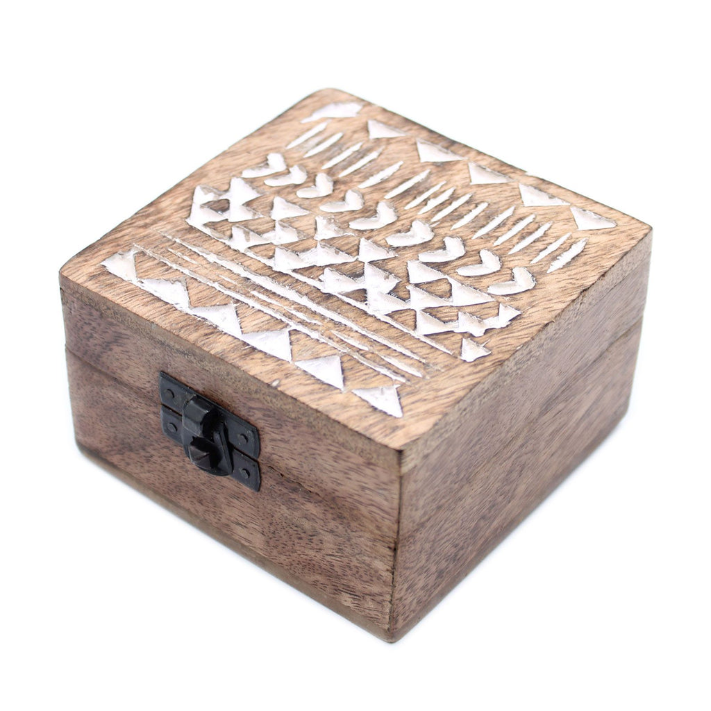 Wooden box with geometric cutout design on a white background
