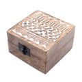 Wooden box with geometric cutout design on a white background
