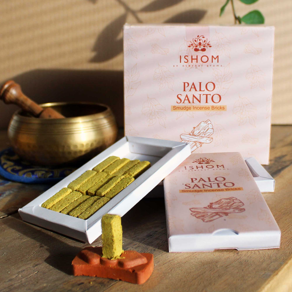 Ishom Palo Santo incense sticks with packaging on a wooden surface