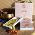 Ishom Palo Santo incense sticks with packaging on a wooden surface