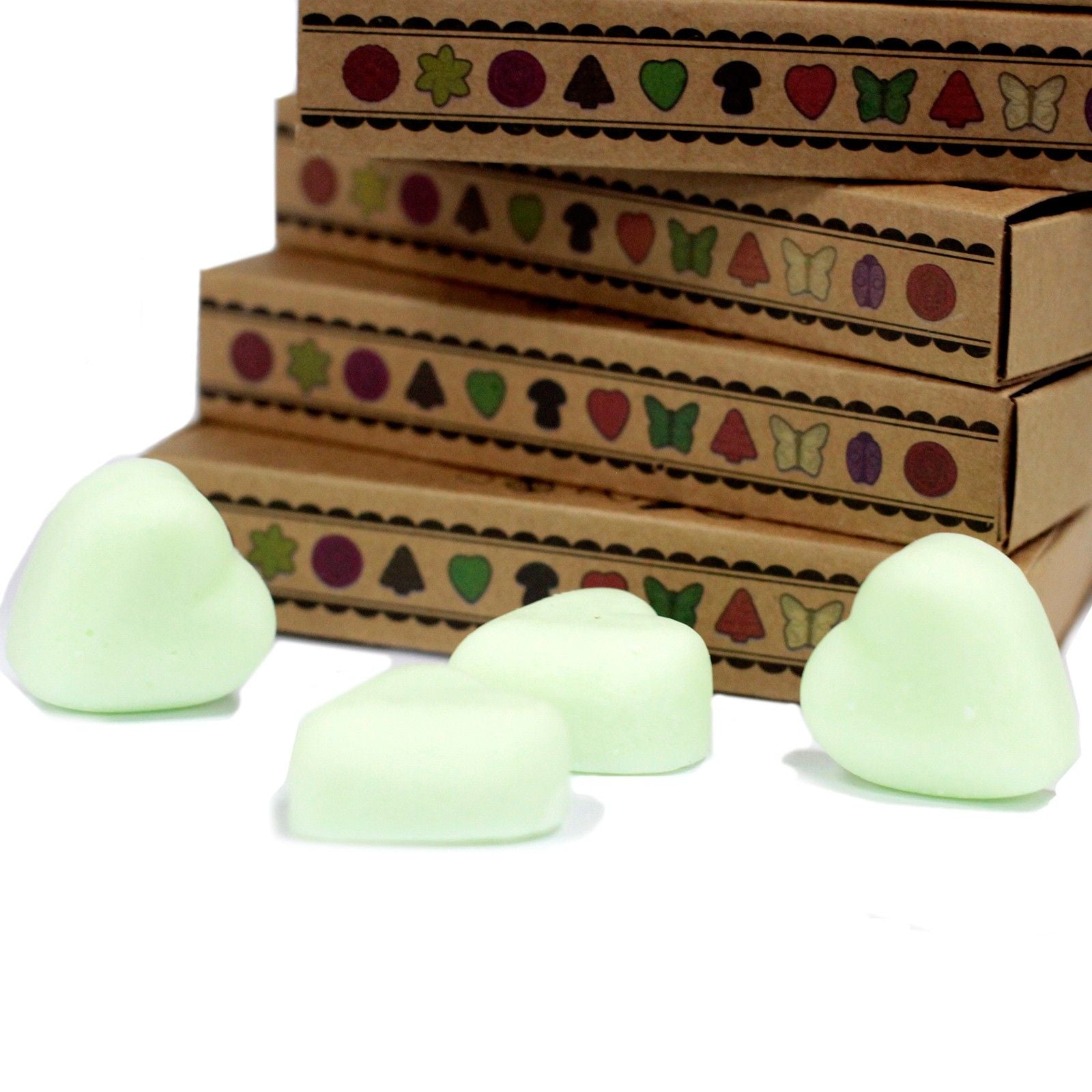 Glowing green stones in front of a decorative wooden box