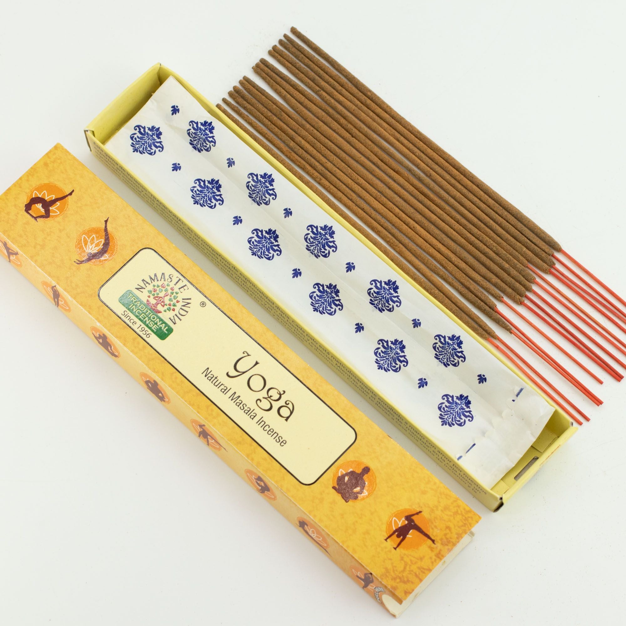 Yoga incense sticks in an open box on a white background
