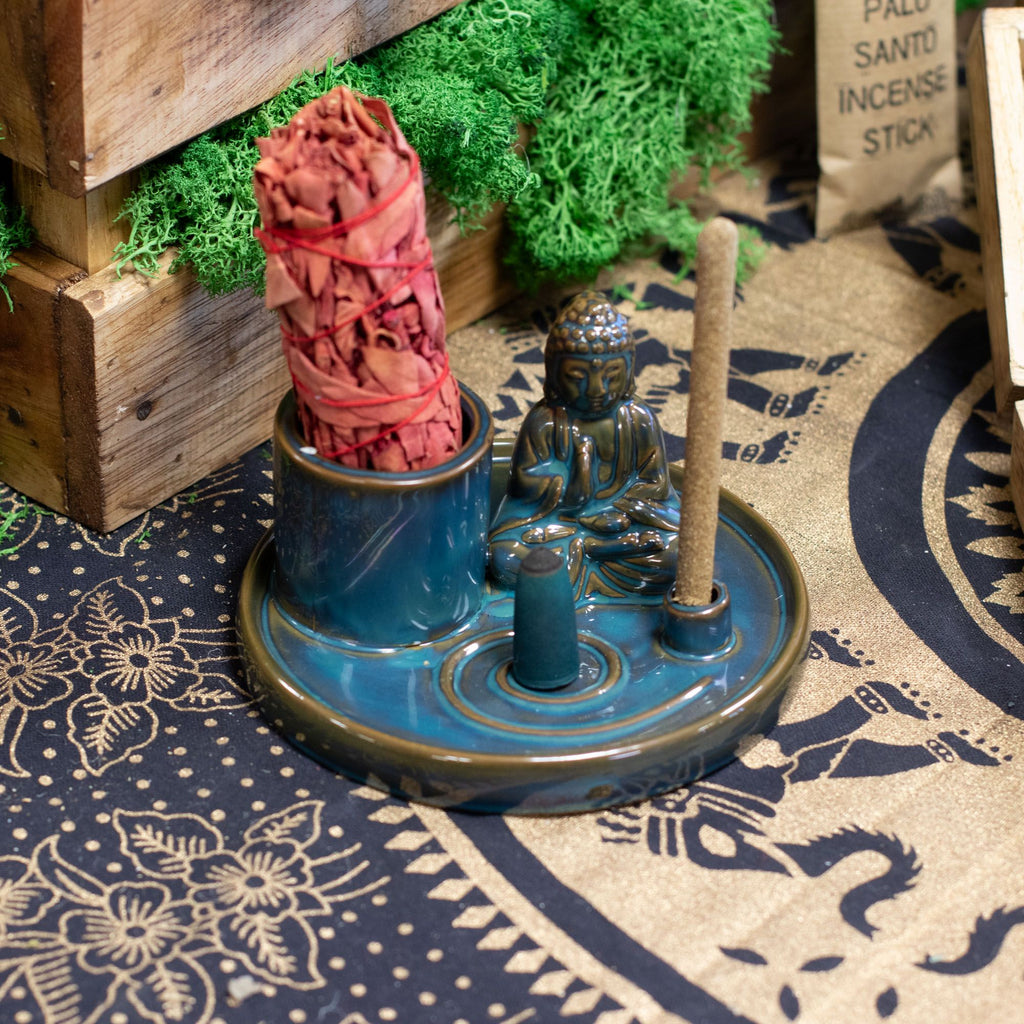 Incense holder with incense sticks on a patterned surface