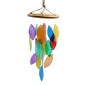 Colorful wind chime with leaf-shaped pieces on a white background