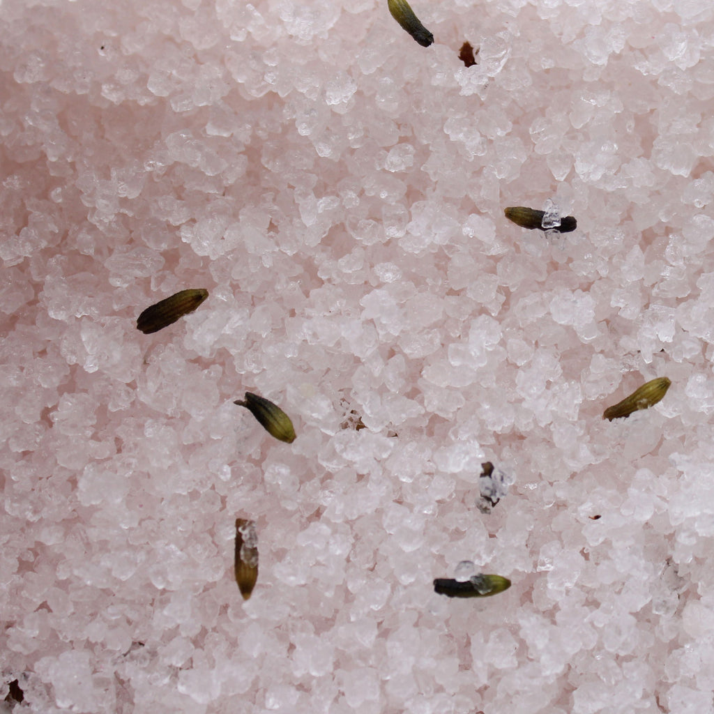 Small seeds or sprouts on a pinkish surface