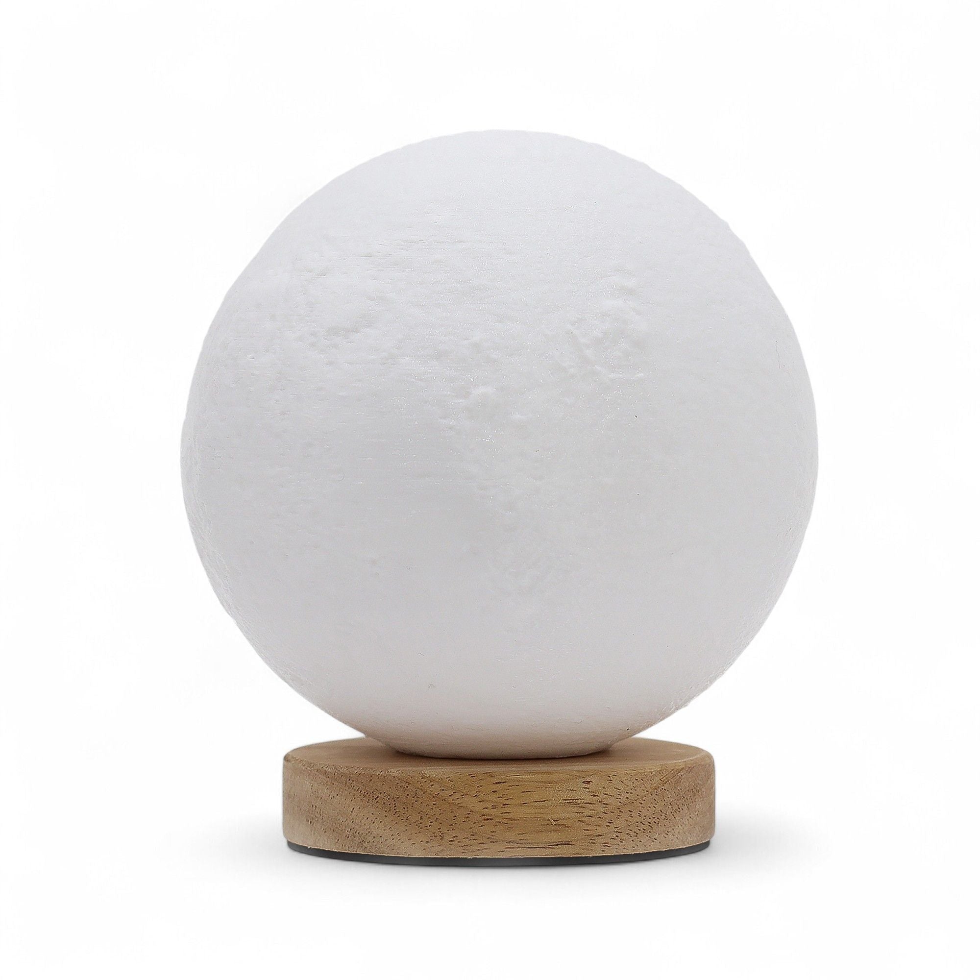 White spherical lamp with a wooden base on a white background