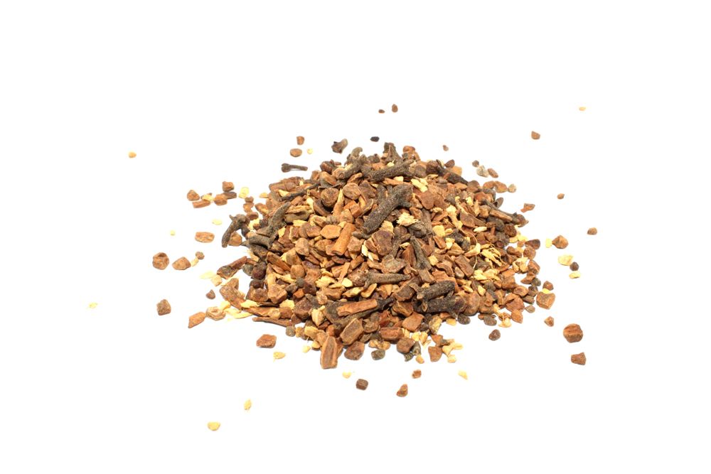 Heap of dried herbs on a white background