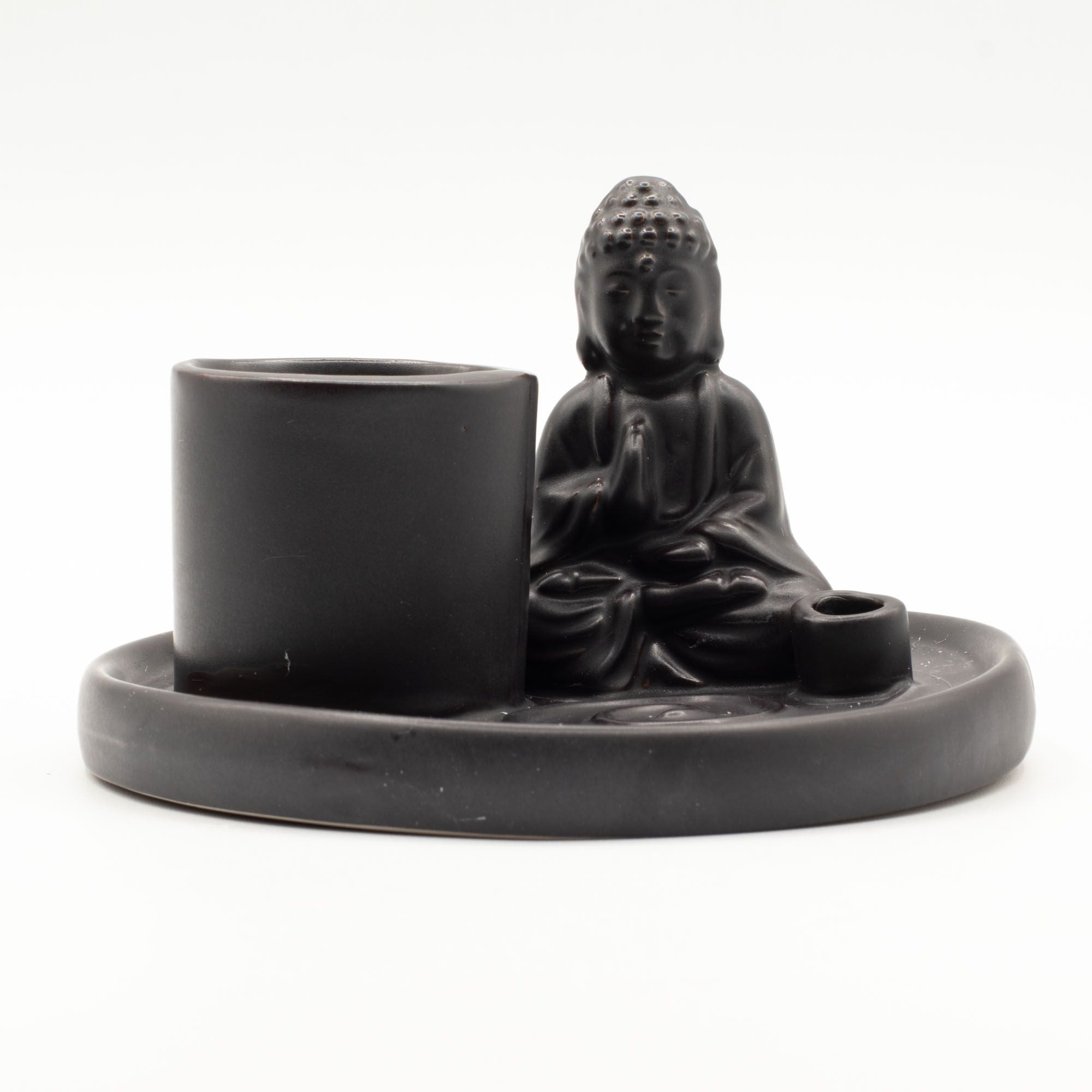 Black ceramic Buddha figure with a cup and small bowl on a matching tray against a white background