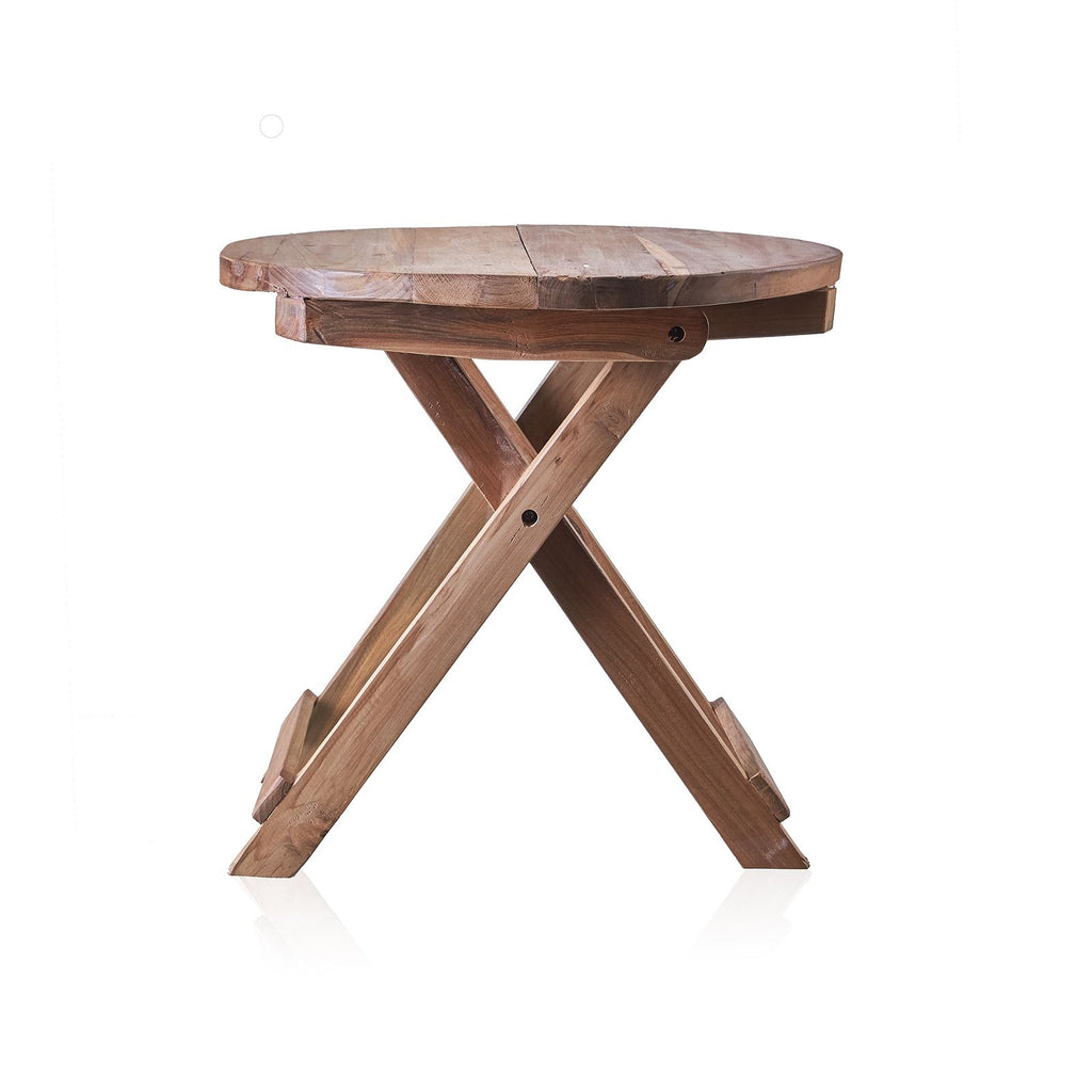 Wooden round table with X-shaped legs on a white background