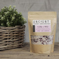 Himalayan salt packaging labeled 'Ancient Wisdom' with a plant in the background