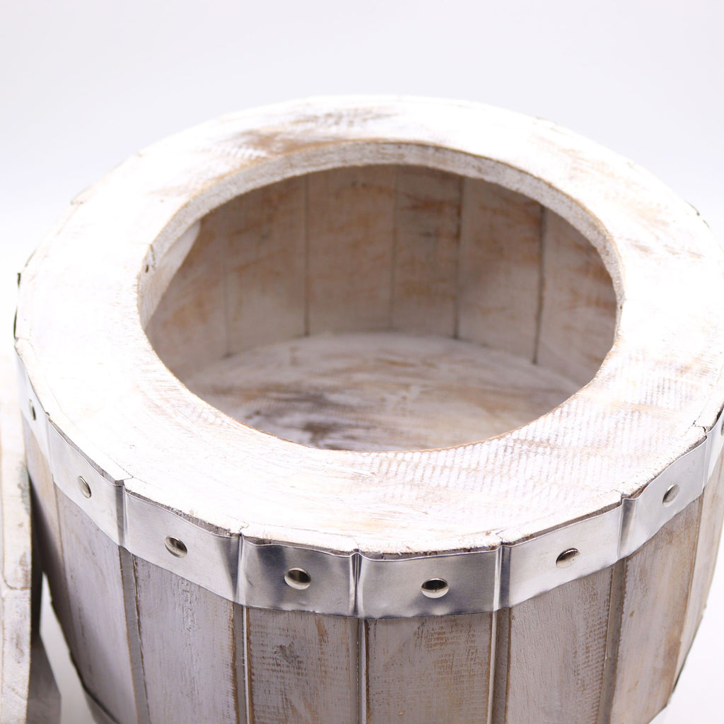 Wooden wine press with metal bands on a white background