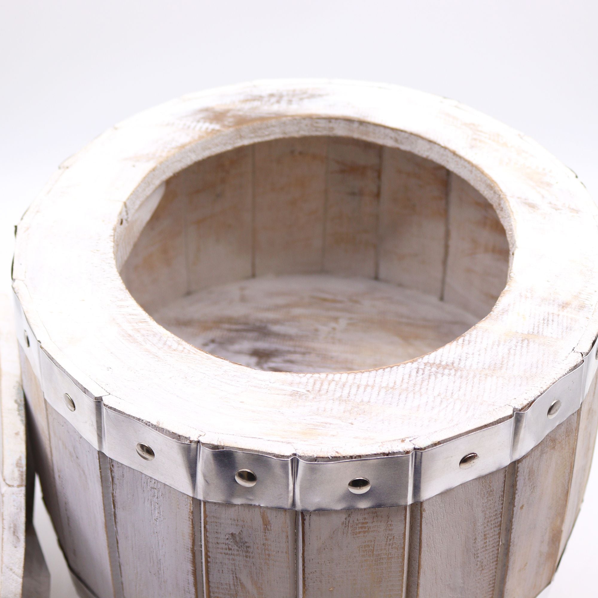 Wooden wine press with metal bands on a white background
