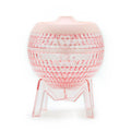 Pink woven stool on a white background