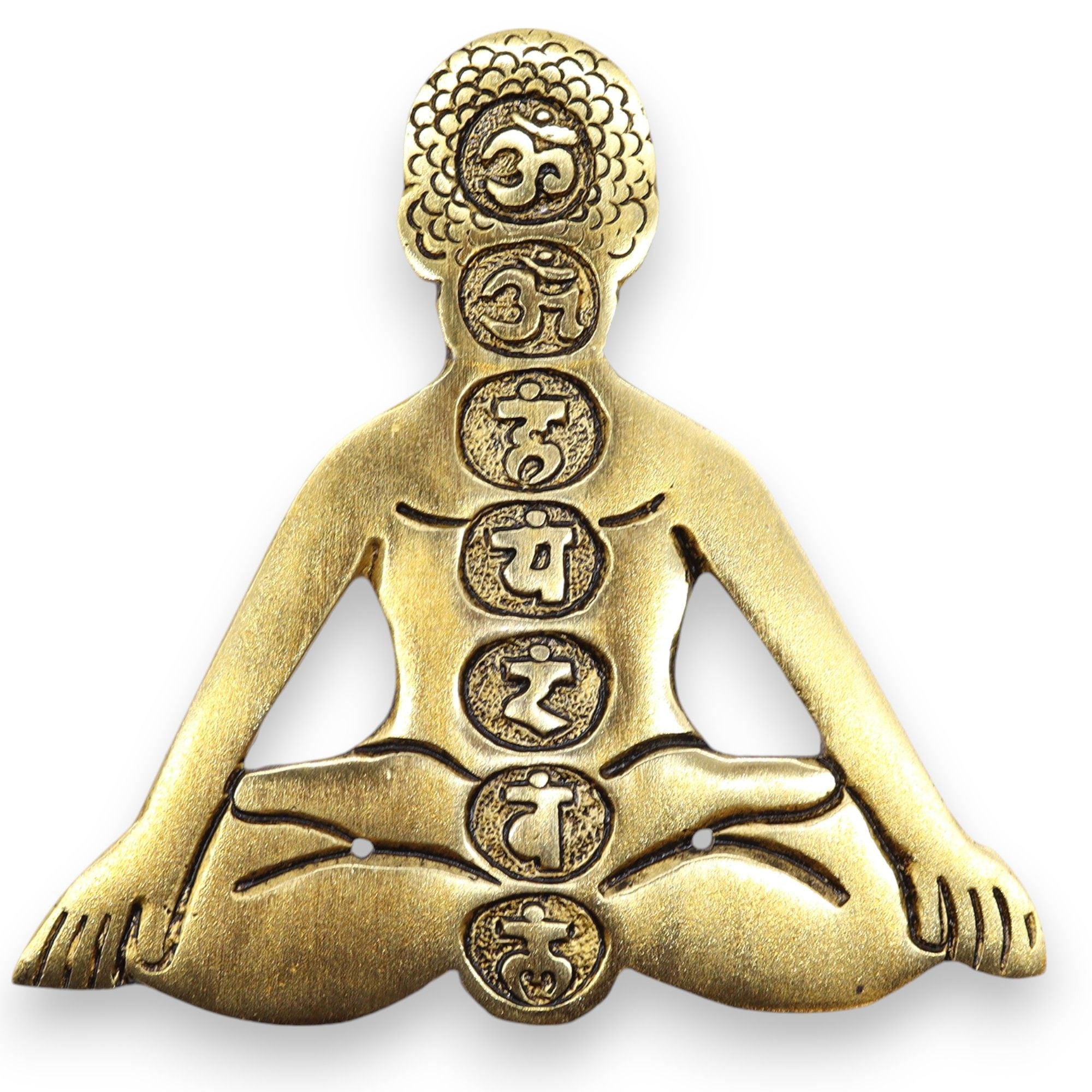 Bronze pendant of a meditating figure with symbols on a white background