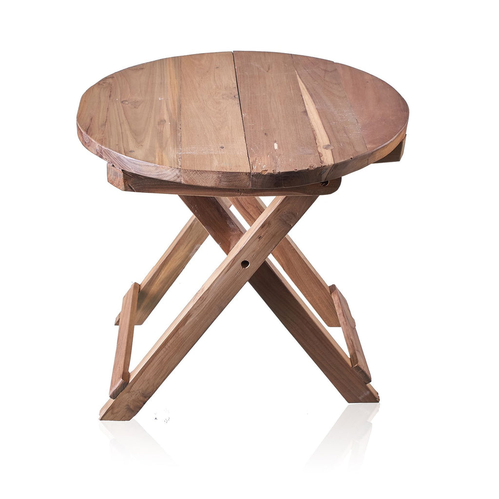 Wooden round table with a X-shaped base on a white background